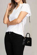 Embroidered eyelet blouse with ruffle